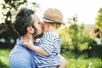Father kissing his little son — Stock Photo