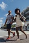 USA, Florida, Miami Beach, happy young couple crossing the street — Stock Photo