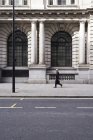 UK, London, senior businessman walking on pavement — Stock Photo