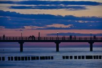 Germany, Mecklenburg-Western Pomerania, Zingst, sea bridge at sunset — Stock Photo