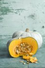 Whole and sliced Cucurbita maxima pumpkins — Stock Photo
