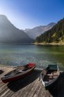 Austria, Tyrol, Allgaeu Alps, Tannheim Mountains, View of boats on lake Vilsalpsee — Stock Photo