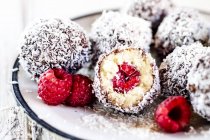 Lamington bliss balls with cashews, filled with raspberries, dark chocolate and coconut flakes — Stock Photo