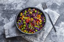 Salad with edamame, maize, red cabbage, carrot, bulgur, tomato — Stock Photo