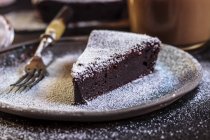 Swedish kladdkaka, dark chocolate cake, swedish brownie, with coffee, close-up — Stock Photo