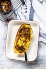 Baked spaghetti squash with vegan bolognese sauce made from lentils, leeks, and carrots — Stock Photo