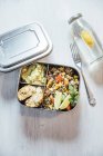 Bento box of quinoa salad with vegetables and lime, avocado cream and cauliflower dumplings — Stock Photo