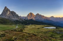 Italy, Veneto, Dolomites, Giau Pass, Croda del Becco, Tofana and Gusela at sunrise — Stock Photo
