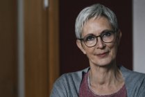 Portrait of confident mature woman at home — Stock Photo