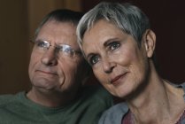 Portrait of confident senior couple looking away — Stock Photo