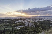 Greece, Athens, cityscape from Acropolis with observatory and Areopagus at sunset — Stock Photo