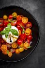 Bowl of tomato salad with burrata — Stock Photo