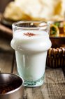 Glass of sweet Lassi with rosewater and saffron — Stock Photo