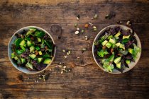 Various leaf salad with avocado, roasted seeds, almonds and soy beans — Stock Photo