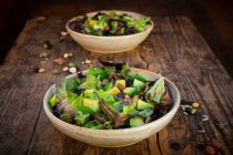 Various leaf salad with avocado, roasted seeds, almonds and soy beans — Stock Photo