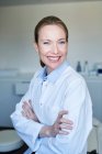 Portrait of smiling female doctor in medical practice — Stock Photo