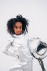 Portrait of little girl with space hat wearing space suit in front of white background — Stock Photo
