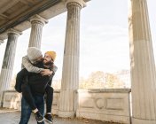 Happy young couple having fun in an arcade in the city, Berlin, Germany — Stock Photo