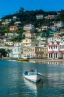 White motorboat moored at harbor of St Georges, capital of Grenada, Caribbean — Stock Photo