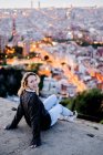 Portrait of happy young woman at dawn above the city, Barcelona, Spain — Stock Photo