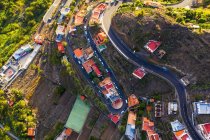 Espanha, Ilhas Canárias, La Gomera, Valle Gran Rey, El Retamal, Vista aérea da cidade e estradas em paisagem montanhosa — Fotografia de Stock