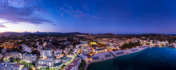 Spain, Balearic Islands, Mallorca, Calvia region, Aerial view over Costa de la Calma and Santa Ponca with hotels and beaches at sunset — Stock Photo