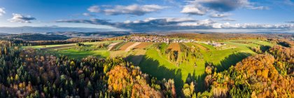 Germany, Baden Wurttemberg, Rems-Murr-Kreis, Aerial view of village and forest in Autumn — Stock Photo