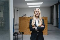 Portrait of a confident young businesswoman in loft office — Stock Photo
