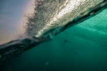 Indonesia, Bali, Underwater view of ocean wave — Stock Photo