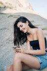 Happy young woman looking at cell phone, Almeria, Spain — Stock Photo
