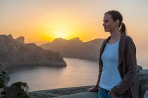 Relaxed woman enjoying sunset at Cap Formentor, Mallorca, Spain — Stock Photo