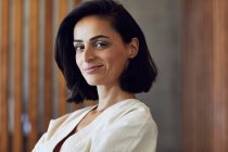 Close-up of confident female entrepreneur sitting in office — Stock Photo