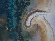 Indonesia, Bali, Sanur, Aerial view of kayakers in front of coastal retaining wall — Stock Photo