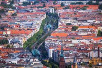 Germany, Berlin, Aerial cityscape of residential district with railroad tracks in middle — Stock Photo
