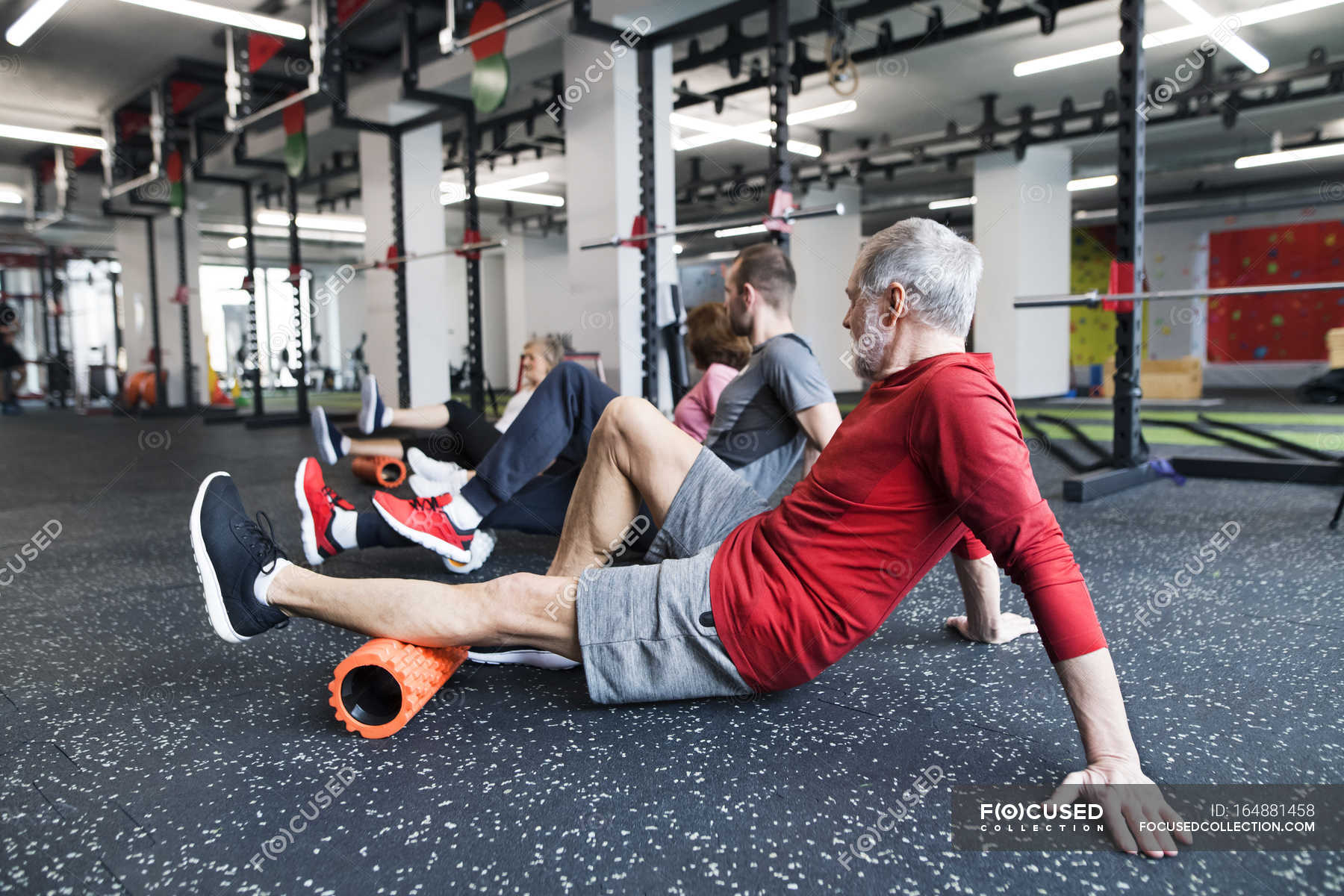Seniors using foam rollers in gym — 30 years, endurance - Stock Photo | #164881458