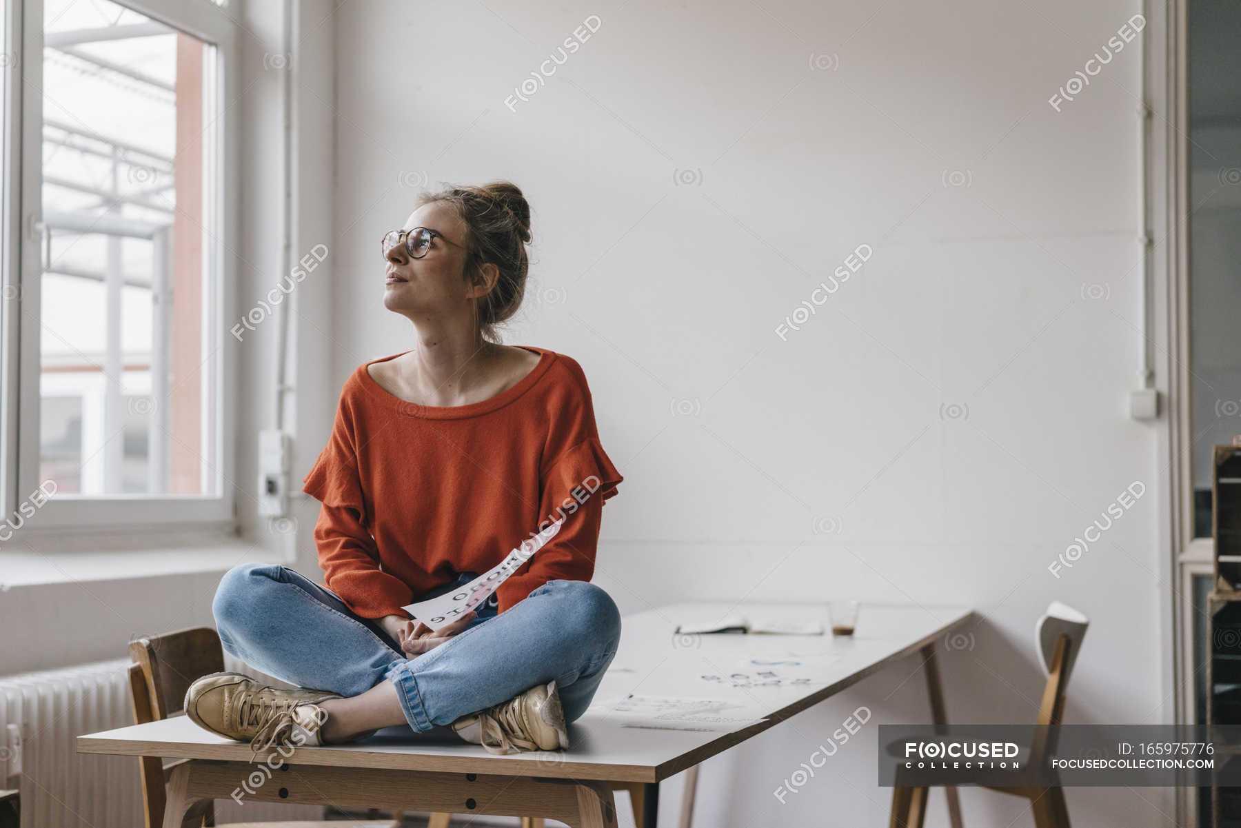 Premium Photo  Pensive woman sitting at table while thinking