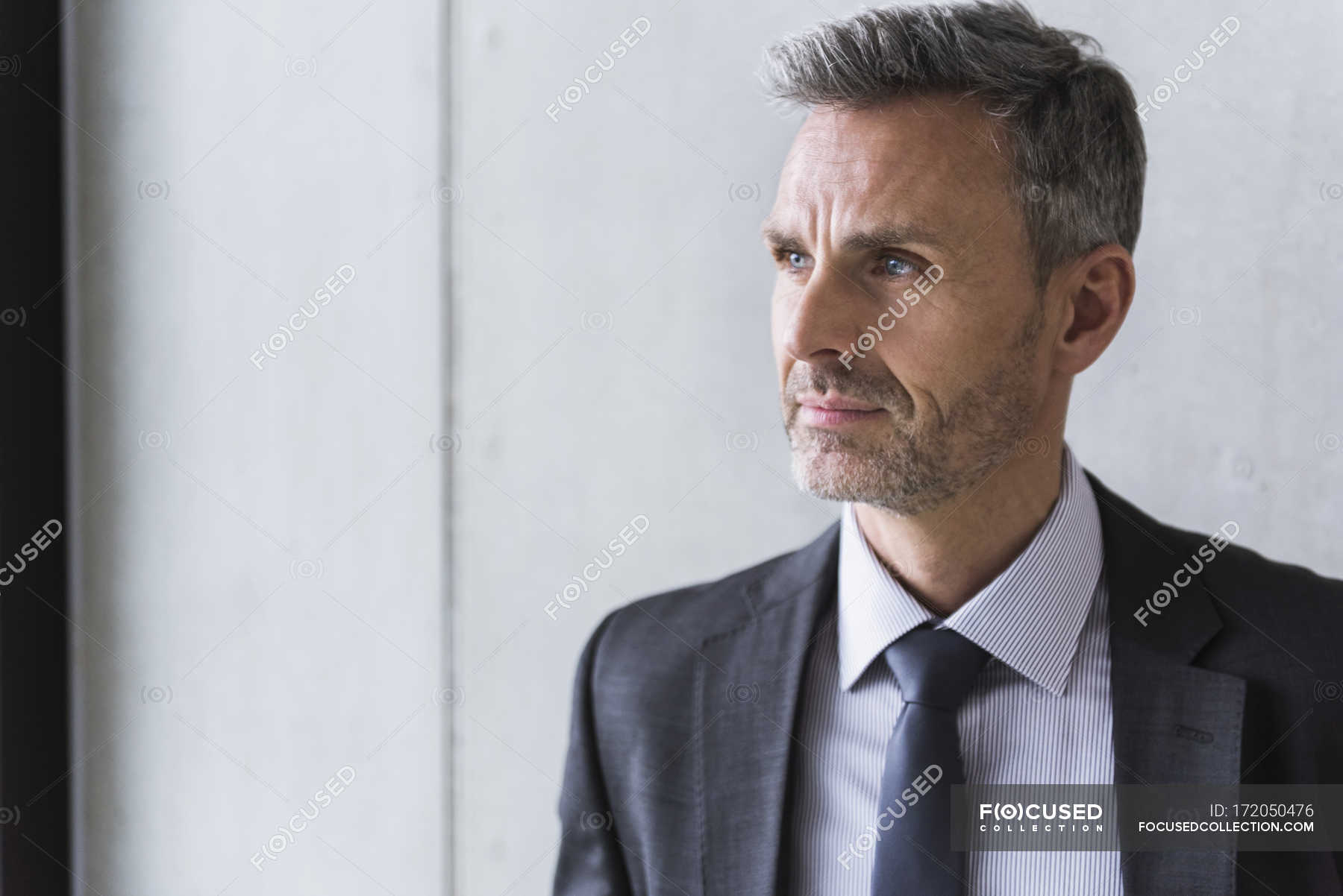 Businessman Looking Sideways Male Content Stock Photo