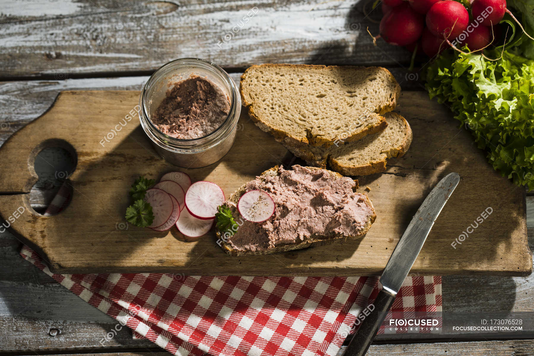 Liverwurst spread on slice of brown bread — food, appetite Stock