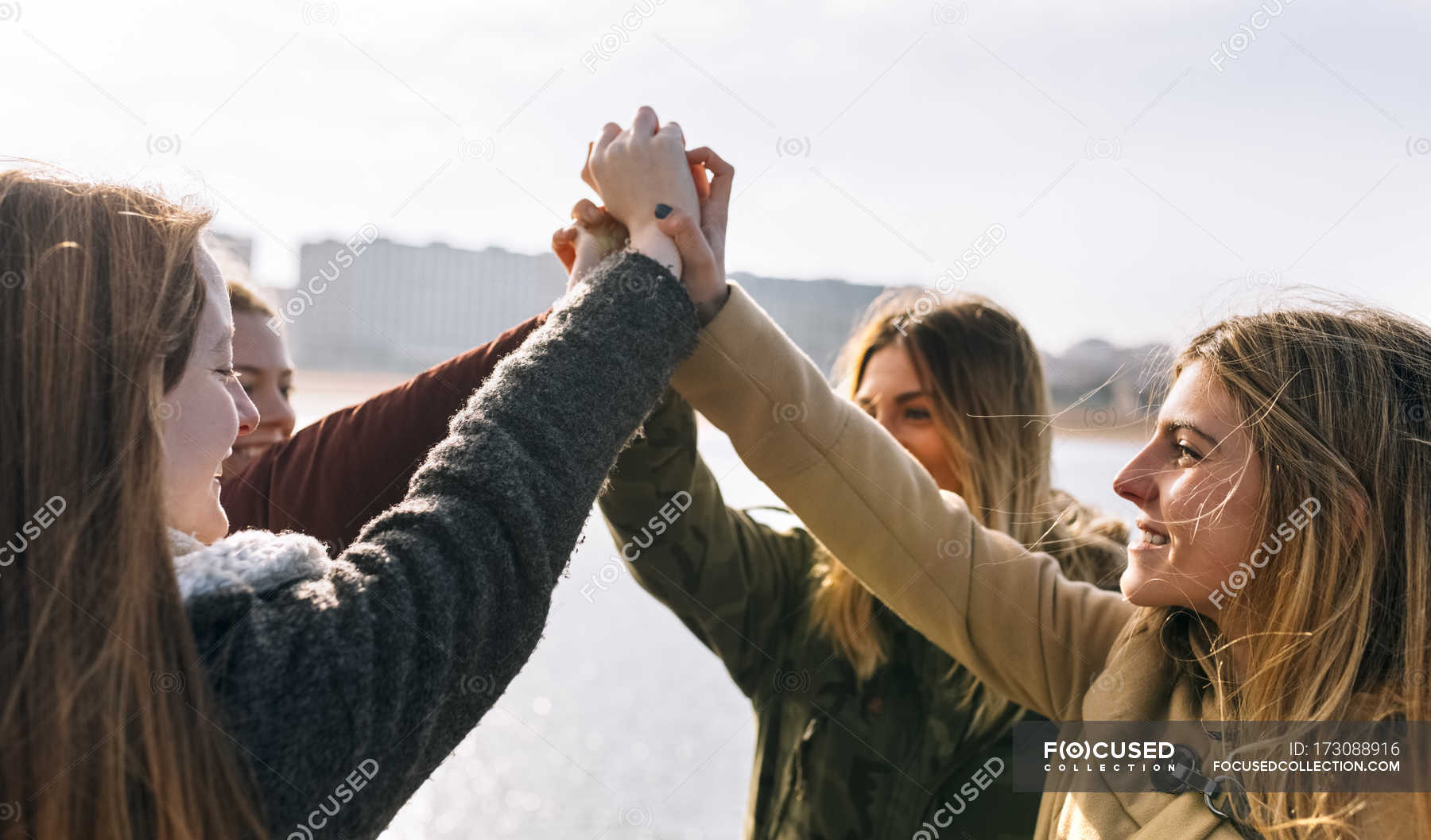 Four friends joining hands in city — youth, trip - Stock Photo ...