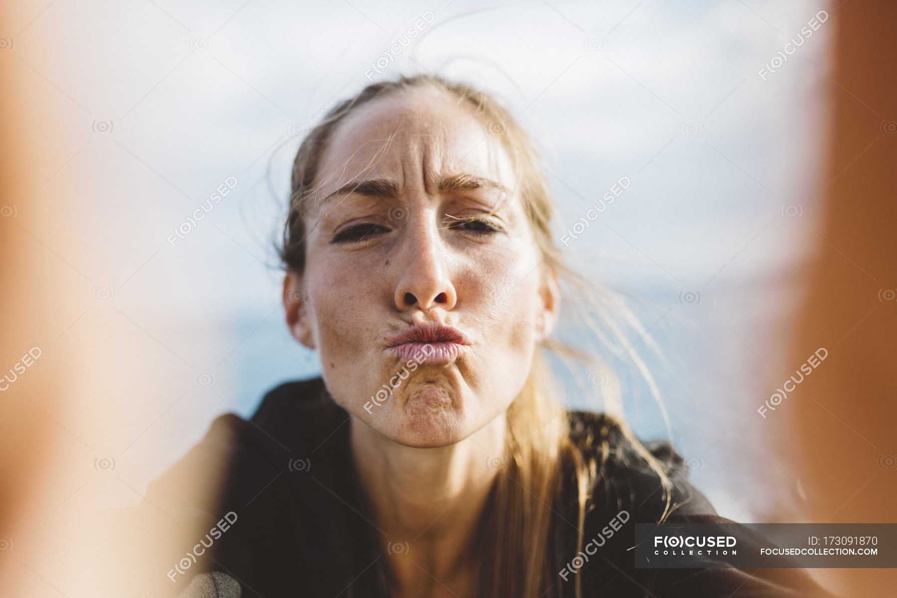 selfie-of-funny-young-woman-pouting-selective-focus-front-view