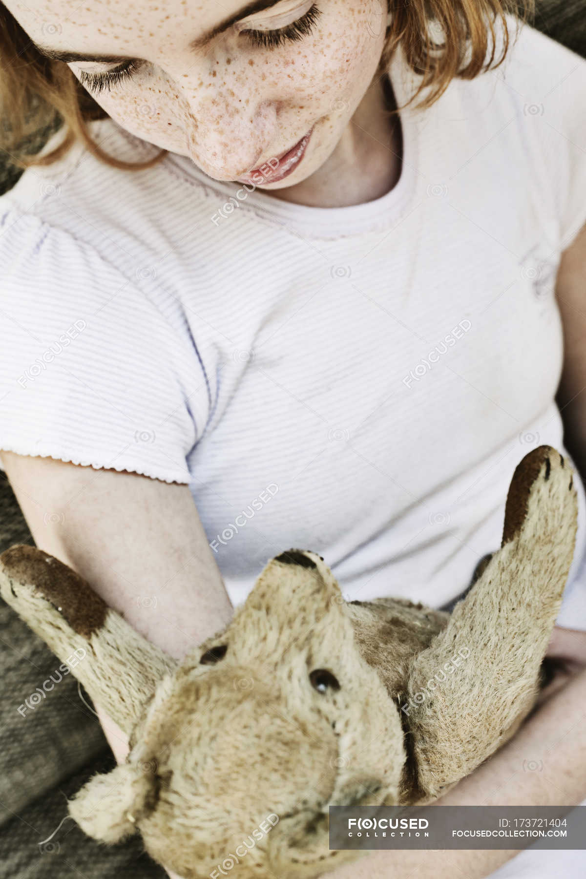 rat holding teddy bear