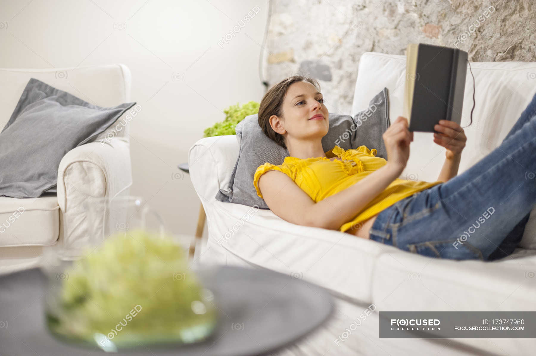 Woman Lying On Couch And Reading A Book Selective Focus Lying