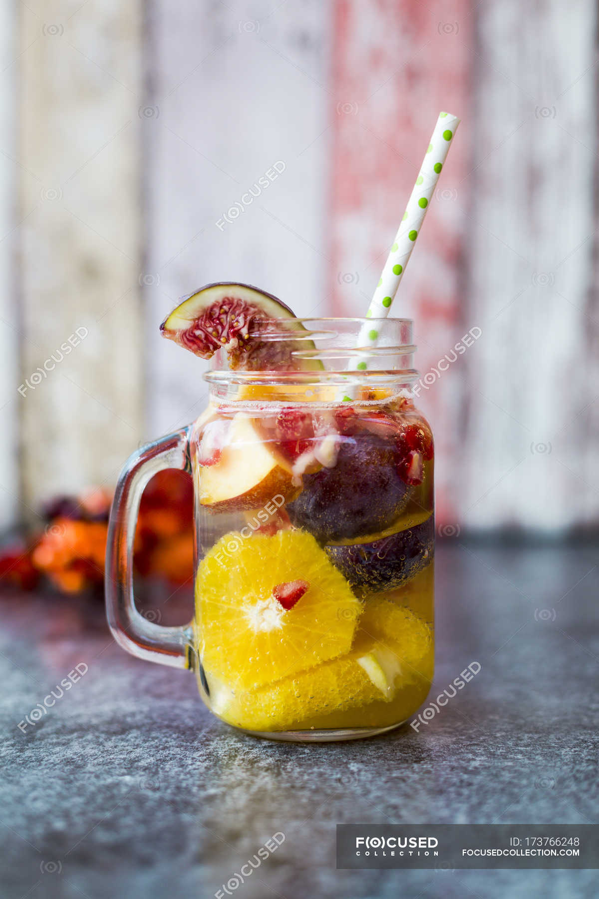 Jar Of Infused Water With Orange Slices, Fig, Pomegranate Seeds 