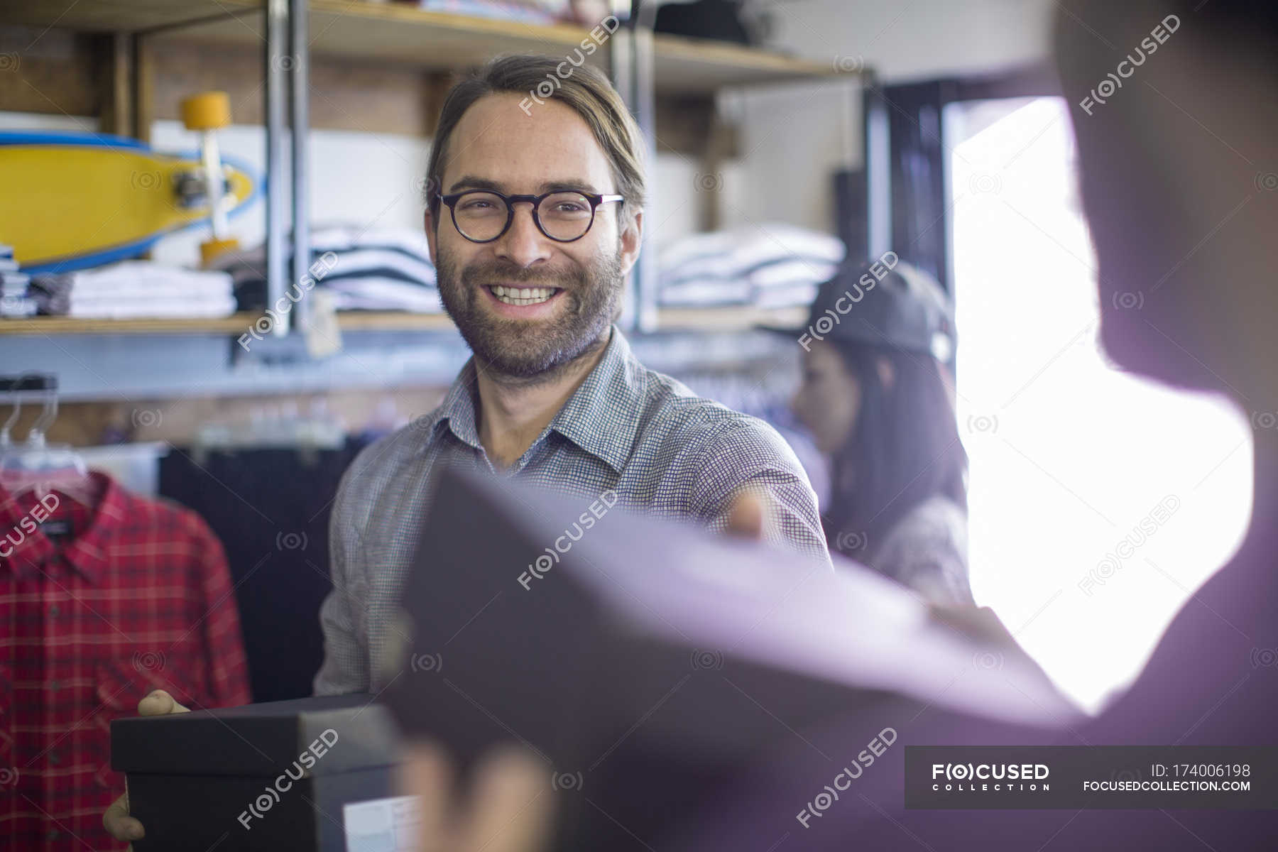 Man buying shoes in fashion shop — millenials, shopping - Stock Photo |  #174006198