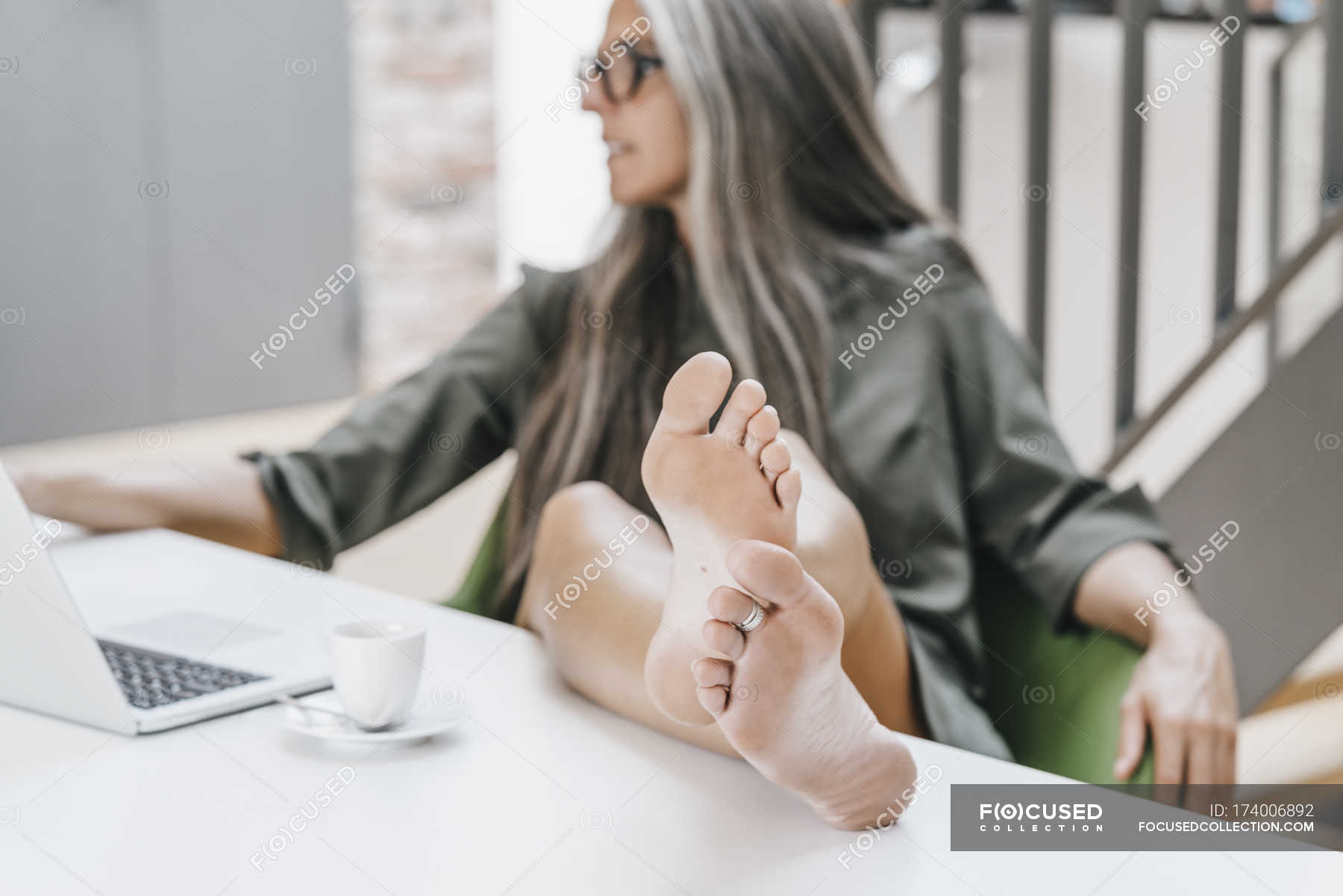 Focused 174006892 Stock Photo Woman Working Office Bare Feet 