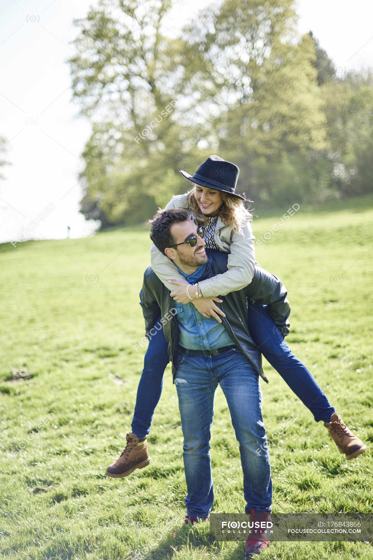 Midadult Caucasian Woman Giving Man Piggyback Stock Photo 3194063