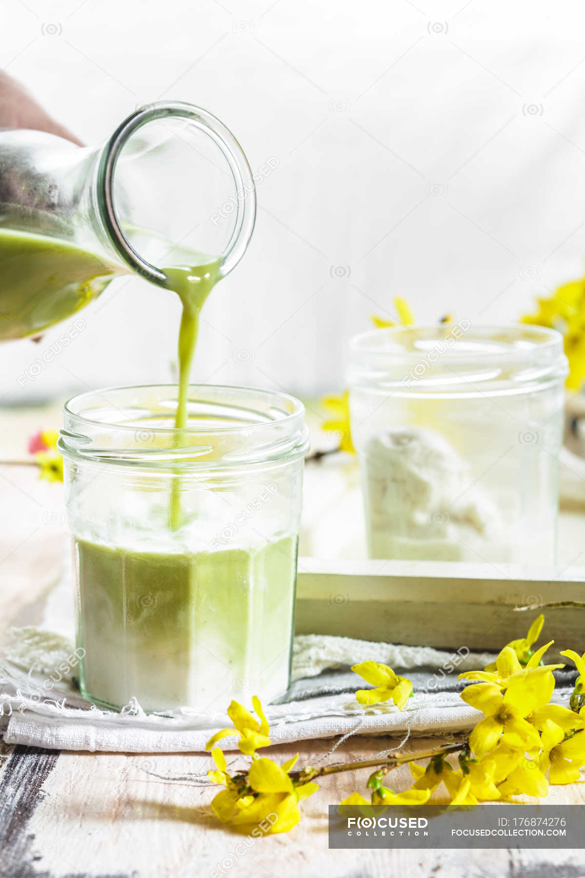 Vegan matcha latte with coconut and almond milk — person, Cropped