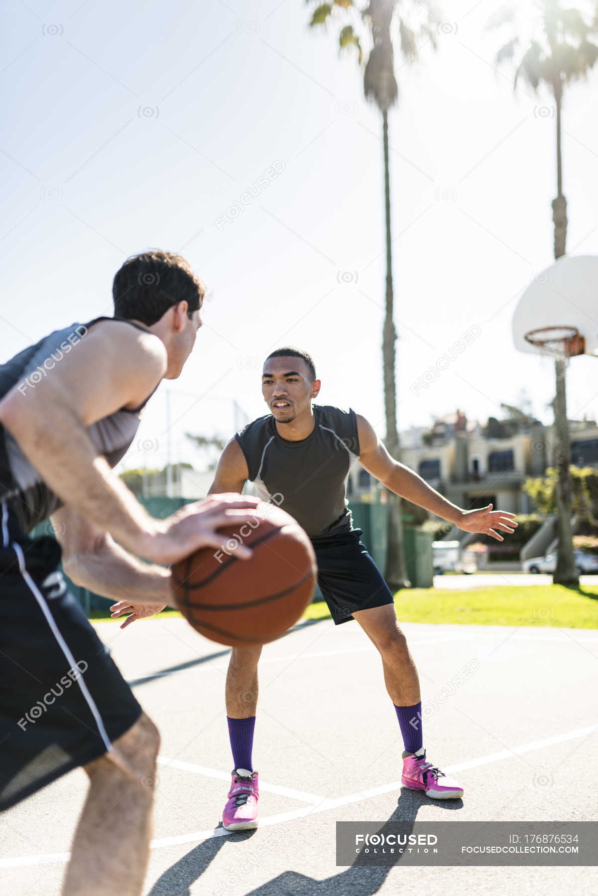 friends playing basketball