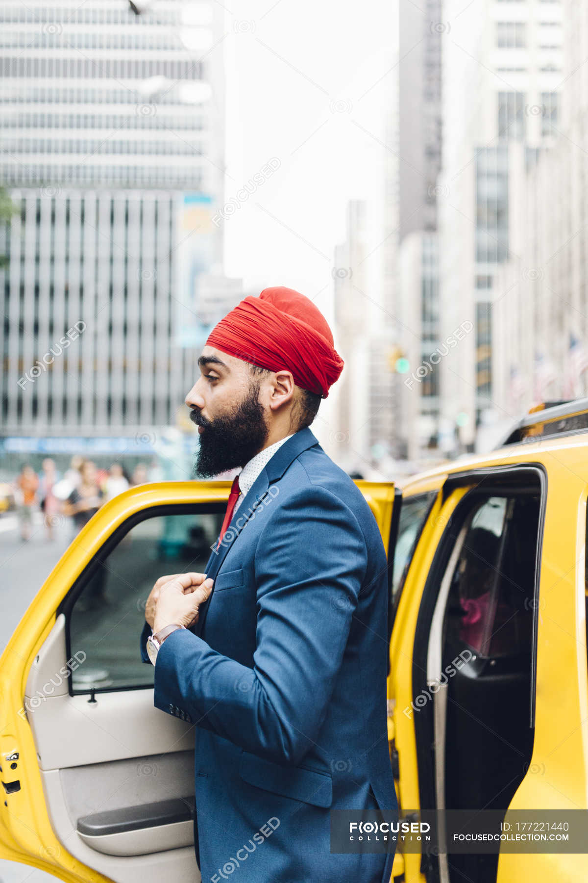 Indian Businessman Beside Taxi Cub In Manhattan Ny Usa Success Vertical Stock Photo