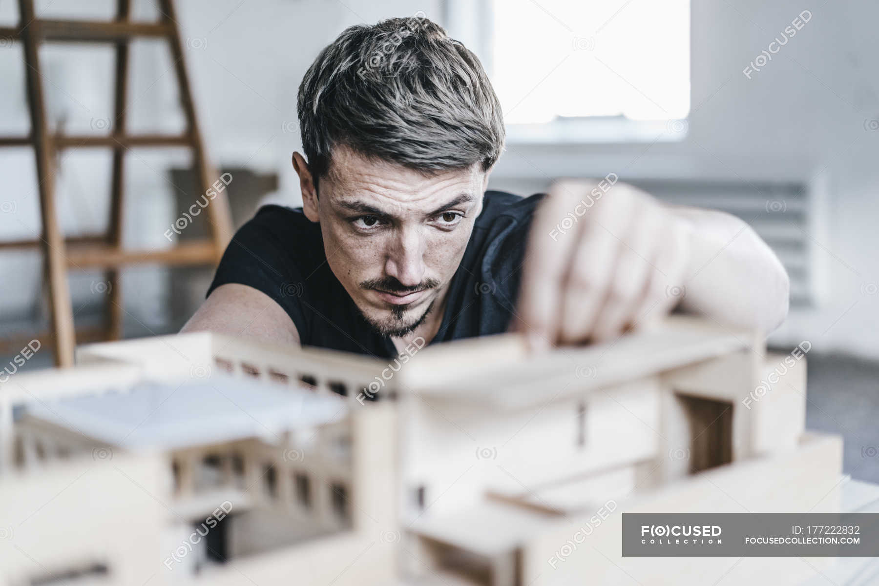 Closeup of Architect working on architectural model — moving, real